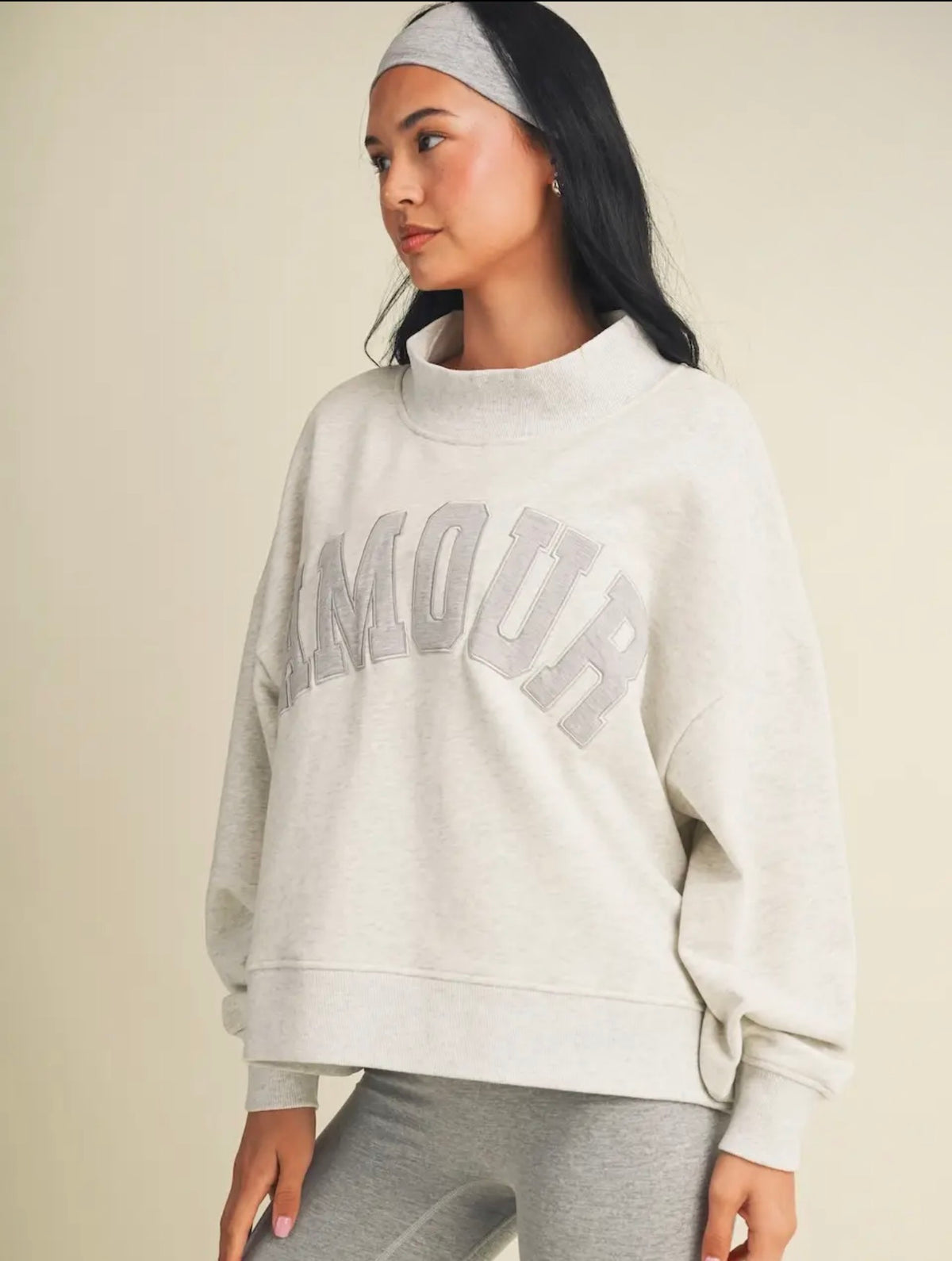 Side view of heather grey Amour oversized mock neck sweatshirt