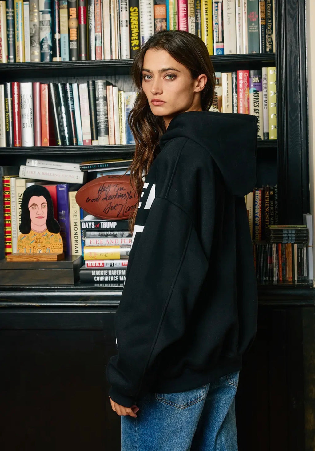 Side and back view of black oversized pullover hoodie